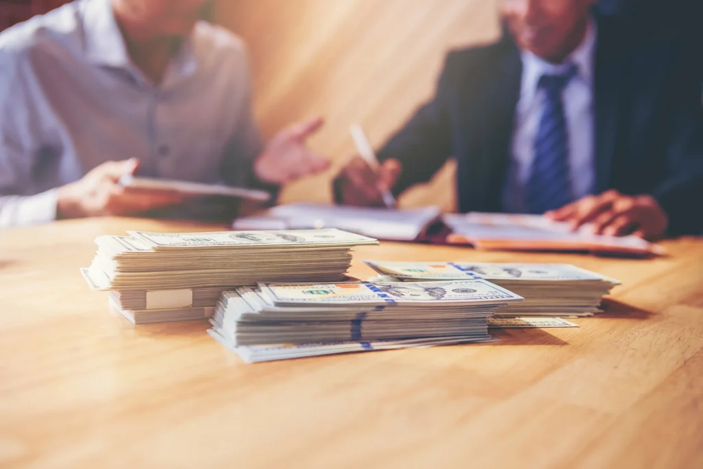 Business men discussing a commercial real estate transaction.